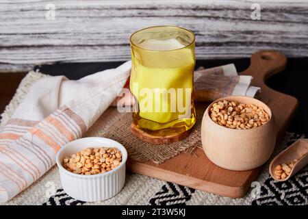 Natural vegan plant based milk - pea milk in creative yellow glass lactose free nutrition Stock Photo