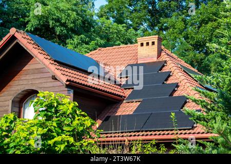 Solar power energy on the roof to a standard house. Solar power panels ,Photovoltaic modules for innovation green energy for life with blue sky backgr Stock Photo