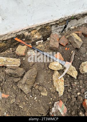 Pickaxe at the scene of a construction site Stock Photo