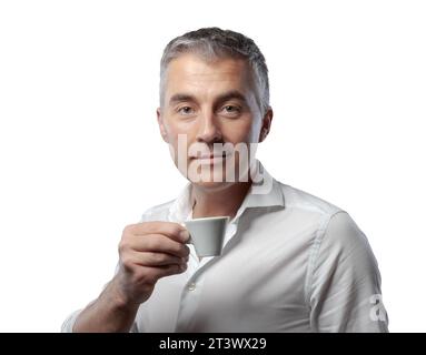 Handsome confident man having a coffee break and drinking espresso Stock Photo