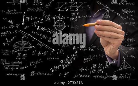 Male hand writing mathematical formulas on blurry background. Science ...