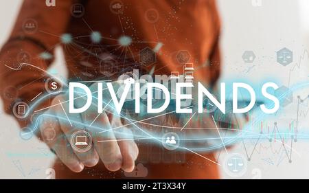Businessman pointing on virtual screen and select dividends. Business concept. Internet concept. Stock Photo