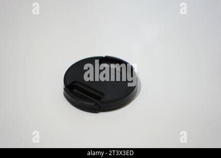 black lens cap with white background Stock Photo