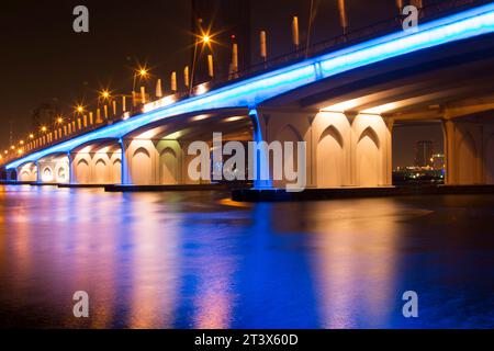 7th November 2014, Dubai, UAE. The illuminated Al Garhoud Bridge in Dubai crossing the Creek. Stock Photo