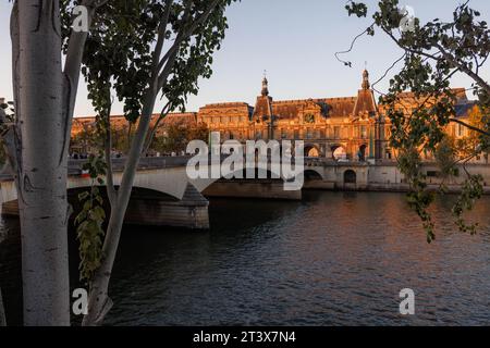 Dusk on the River Seine and the Louvre Museum in Paris. Stock Photo