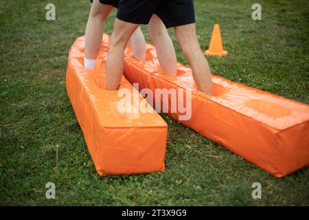 Men feet in shorts. Sports competition in stadium. Stock Photo