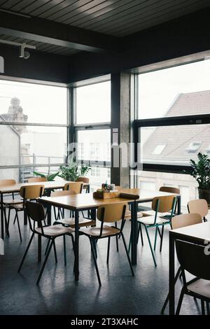 Empty desks and chairs at office Stock Photo