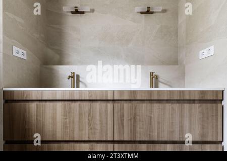 Front image of bathroom with cream marble tiles, Stock Photo