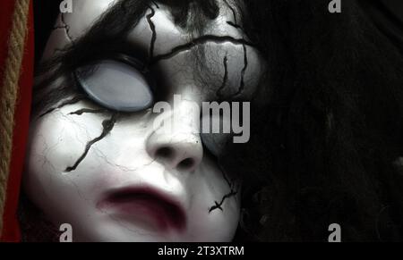 Plastic Halloween Mask Of A Scary Zombie Ghost Child, UK Stock Photo