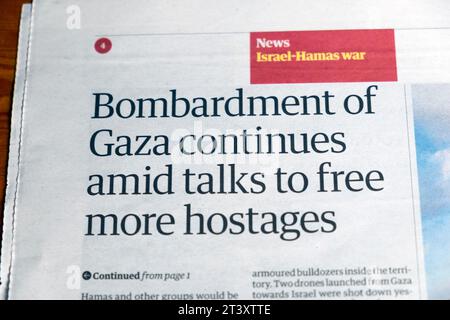 'Bombardment of Gaza continues amid talks to free more hostages' Guardian newspaper headline Israel Hamas war article 24 October 2023 London UK Stock Photo