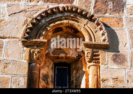 Window detail. The old collegiate church of San Salvador, current parish church, located in the town of San Salvador de Cantamuda. One of the most imp Stock Photo