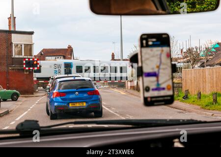 Railway level crossing with the barriers down. Brockenhurst, New Forest, Hampshire, England, United Kingdom, Europe Stock Photo