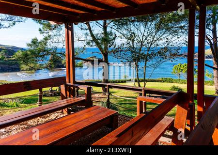 Beach bar tables and benches. Porcía beach is located in the Asturian council of El Franco and is shared with Tapia de Casariego. Principality of Astu Stock Photo