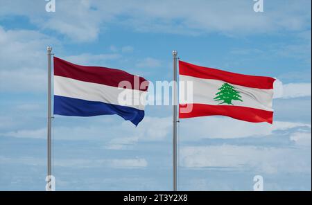 Lebanon and Netherlands flags waving together in the wind on blue cloudy sky, two country relationship concept Stock Photo