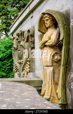 Toronto, Canada, Side view of stone sculpture or statue in an ancient wall. The architectural feature is part of a group of ruins saved from demolitio Stock Photo