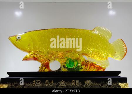gold dragon fish carving in a shop Stock Photo
