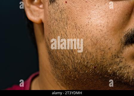 partially blurred side view of face of Indian adult male Stock Photo