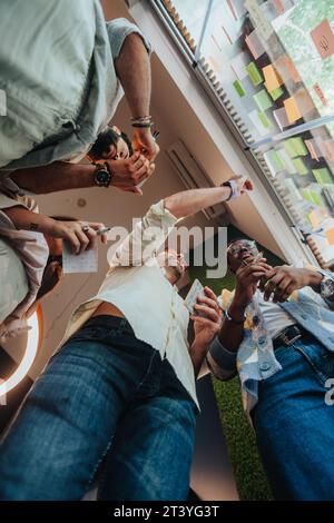 Multinational Creative Team Collaborating on Innovation and Growth Strategies Stock Photo