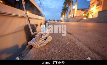 Rope knot of a moored boat close-up shot Stock Photo