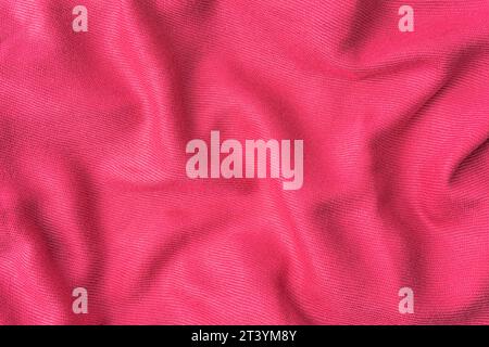 wrinkled pink fabric texture background close-up Stock Photo