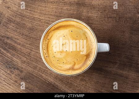 cup of espresso on wooden background top view close-up Stock Photo