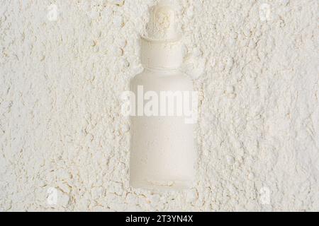 cosmetic bottle print in flour texture close-up Stock Photo