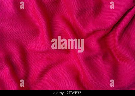wrinkled pink fabric texture background close up Stock Photo