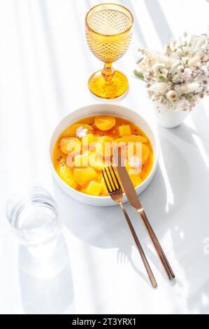 Salmon ceviche in jelly with orange and mango-passion fruit sauce Stock Photo