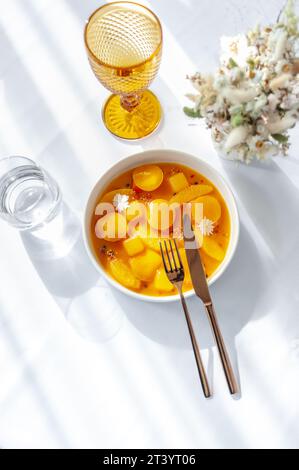Salmon ceviche in jelly with orange and mango-passion fruit sauce Stock Photo