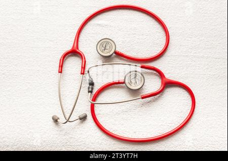 A pair of  Littmann Classic III monitoring stethoscopes (red) Stock Photo