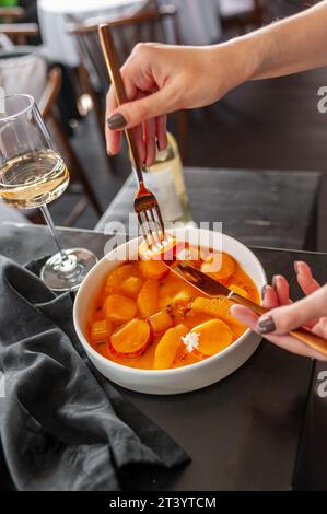 Salmon ceviche in jelly with orange and mango-passion fruit sauce Stock Photo