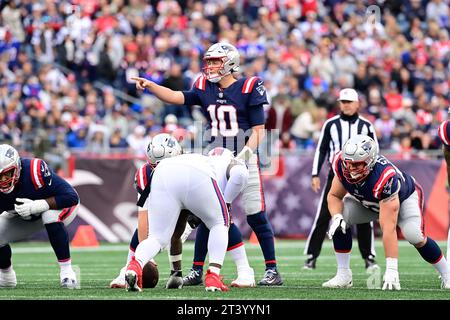 Oct 22, 2023; New England Patriots quarterback Mac Jones (10) signals to the offense during the second half against the Buffalo Bills in Foxborough, Massachusetts. Eric Canha/Cal Sport Media Stock Photo