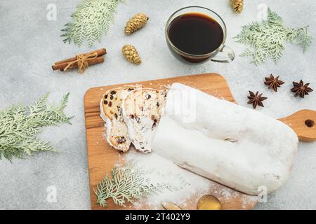 Christmas table with stollen cake and coffee cup with decor. Flat lay, top view Stock Photo