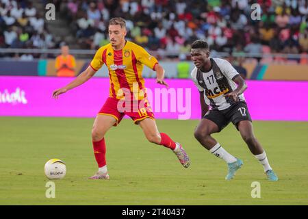 DAR ES SALAAM, TUNISIA – OCTOBER 22:    MOOTEZ ZADDEM of Esperance and  NGALAMULUME BATO of Mazembe during the African Football League match between T Stock Photo