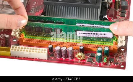 installing RAM memory into computer motherboard Stock Photo