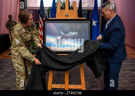 October 20, 2023 - Peterson Space Force Base, Colorado, USA - U.S. Air Force Brig. Gen. Joy Merritt, Individual Mobilization Augmentee to the Space Operations Command commander and Mr. Rick Herter, commissioned artist, reveals painting, High Ground Intercept during a ceremony at Space Operations Command headquarters at Peterson Space Force Base, Colo., Oct. 20, 2023. The artwork is a first for the command and depicts a futuristic U.S. Space vehicle intercepting an adversary satellite, who in turn is positioning to disable a friendly satellite. (Credit Image: © U.S. Space Force/ZUMA Press Wire) Stock Photo