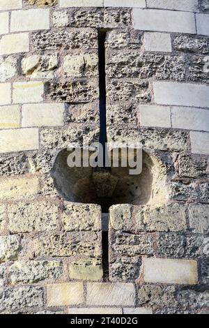 Opening in castle wall for canon fire - Chateau de Tours, Indre-et-Loire (37), France. Stock Photo
