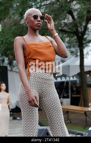 Model poses on the runway at the FDG Design fashion show in Montreal, Quebec,Canada. Stock Photo
