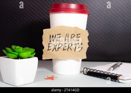 ASK OUR EXPERTS text on a sticky on chart. Stock Photo