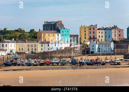 Fishing boats and colourful buildings in the seaside resort town of Tenby in Pembrokeshire, Wales Stock Photo