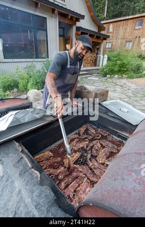 Grilling short ribs on a wood fire grill at the Minam River Lodge, Oregon. Stock Photo