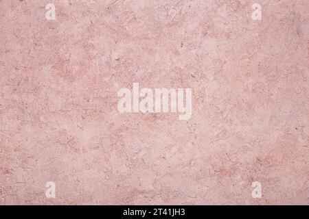 Abstract background of concrete stone pink wall. The texture of the stone surface. Old worn out wall Stock Photo