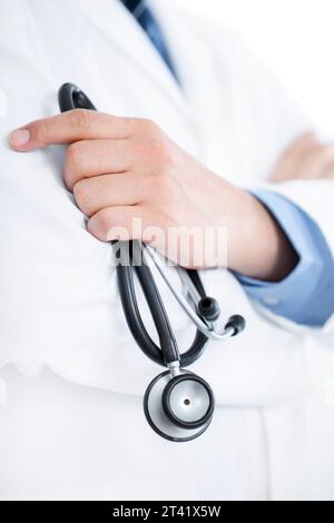 Doctor holding stethoscope Stock Photo