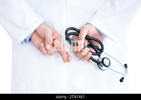 Medical doctor with a stethoscope and hands behind his back Stock Photo -  Alamy