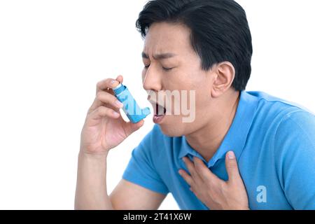 Man using inhaler Stock Photo