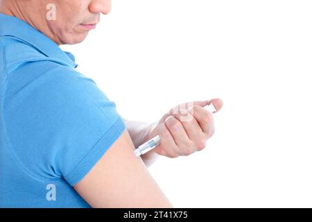 Man self-injecting Stock Photo