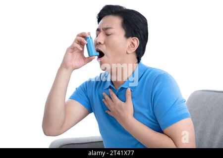 Man using inhaler Stock Photo