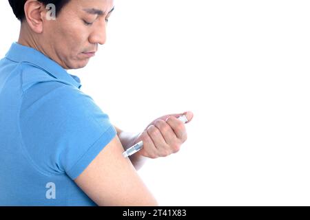 Man self-injecting Stock Photo