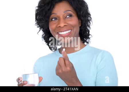 Woman taking a tablet Stock Photo