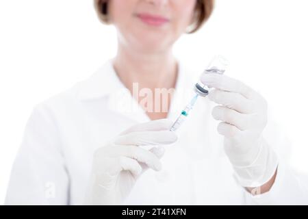 Doctor preparing syringe Stock Photo